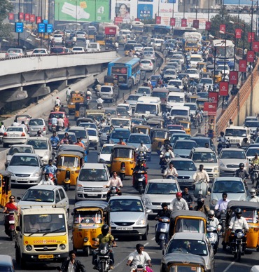 Vehicles move slowly during morning rush hour in Hyderabad.
