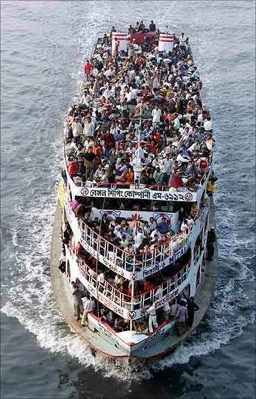 A crowded ferry heads upriver near the Bangladesh capital of Dhaka.