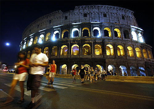 Rome's ancient Colosseum is lit up.