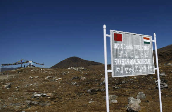 A signboard is seen from the Indian side of the Indo-China border at Bumla in Arunachal Pradesh.