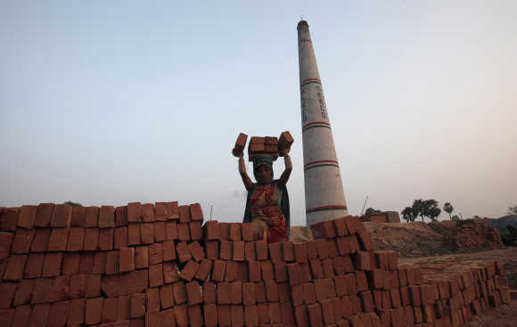 A labourer works at a brick factory at Hajipur industrial park on the outskirts of Patna.