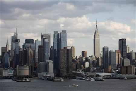The Empire State Building (R) stands tall on the skyline of midtown Manhattan in New York.