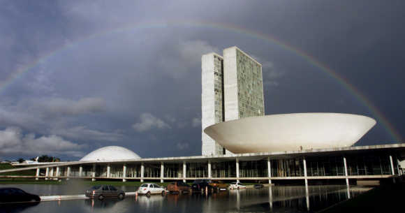 A rainbow forms after a cloudburst over Brazilian Congress in capital Brasilia.