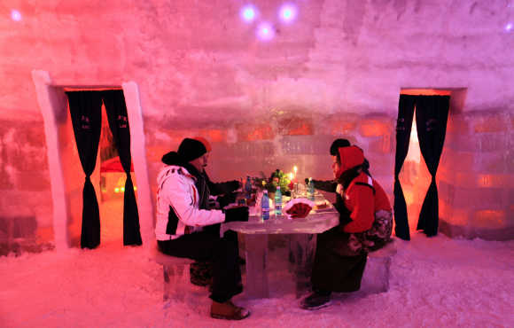 Tourists have dinner inside the Balea Lac Hotel of Ice in the Fagaras mountains, 300km northwest of Bucharest.