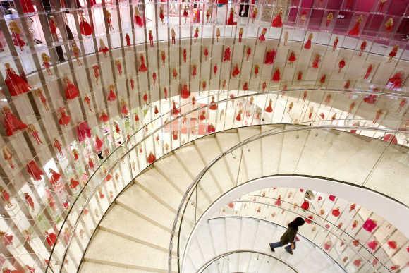 A woman walks past merchandise on display at Mattel's House of Barbie flagship store in Shanghai.