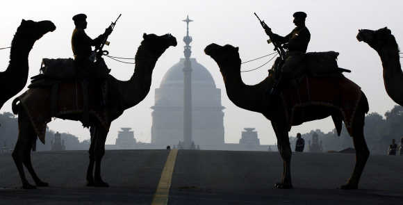 Border Security Force soldiers ride their camels in New Delhi.
