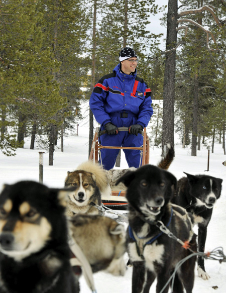 Finnish Prime Minister Jyrki Katainen gets ready for a Husky ride during the informal Lapland meeting on economic affairs in Saariselka, Finland.