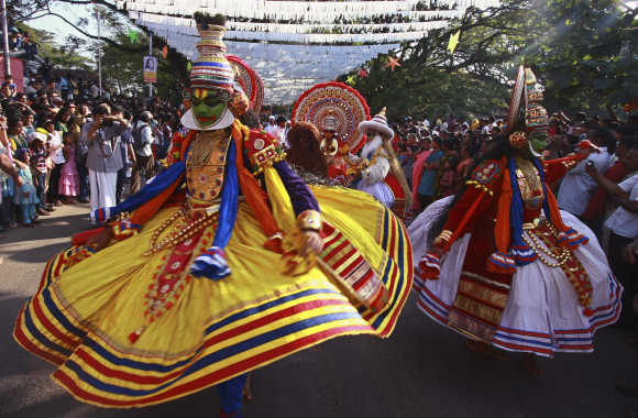 Folk dancers perform during the Cochin Carnival at Fort Kochi in Kochi.