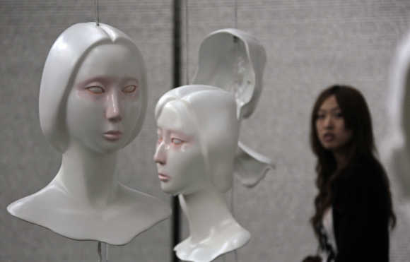 A visitor looks at an art display in Beijing.