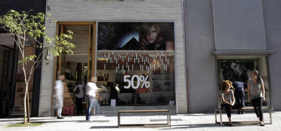 Consumers walk along Oscar Freire street, Sao Paulo's version of Rodeo Drive in Beverly Hills, in Sao Paulo.
