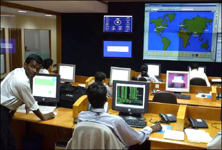 Engineers work in the control room at Infosys Technologies campus at Electronics City in Bangalore.