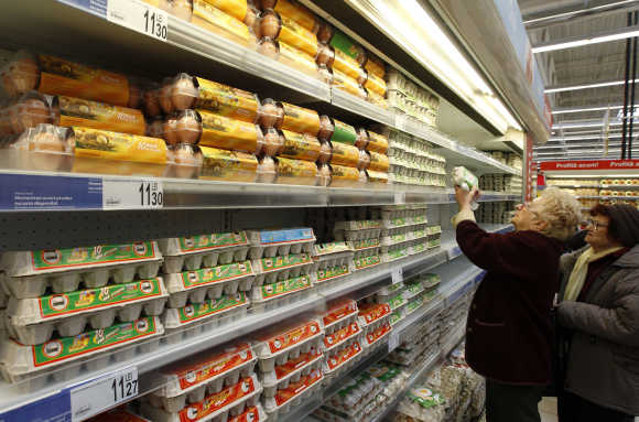 Women buy eggs in a supermarket in Bucharest.