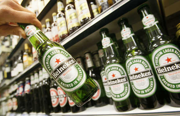 Bottles of Heineken beer are displayed for sale in central London.