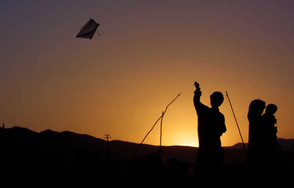 A boy flies a kite in Quetta, Pakistan.