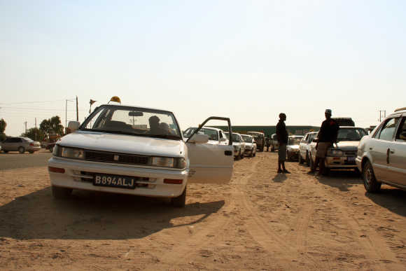 Taxi drivers wait for customers near Gaborone, Botswana.