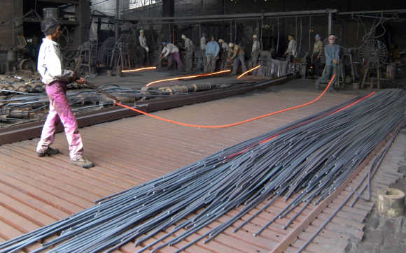 Employees work inside an iron factory in Kanpur.
