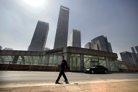 A security guard walks in front of Yintai Centre in Beijing's central business district.