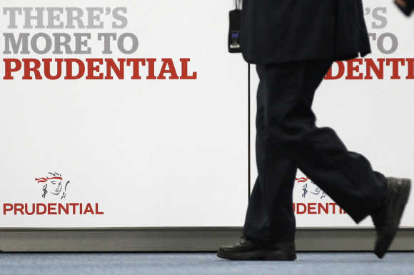 Shareholder arrives at Prudential's annual general meeting in central London.