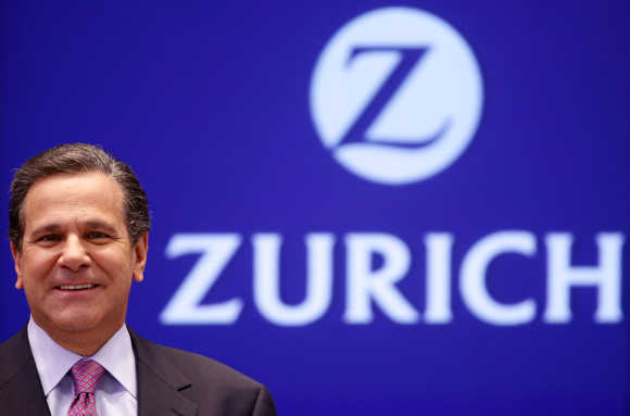 Zurich Financial Services Group CEO James J Schiro smiles as he poses for photographers in Zurich in this file photo.