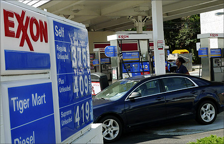 A motorist fills up her car at an Exxon gas station in Arlington, Virginia.