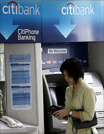 customer leaves Citibank's automated teller machine in Jakarta.