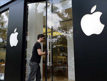 A visitor walks into an Apple store in Clarendon, near Washington.