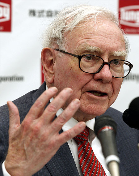 Berkshire Hathaway Chairman Warren Buffett speaks at a news conference.