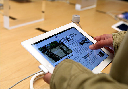 A customer works on the new iPad at the Apple flagship retail store in San Francisco, California.