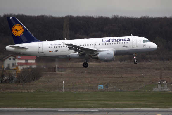 A Lufthansa Airlines Airbus A319 plane prepares to land at Henri Coanda Airport in Otopeni, near Bucharest.