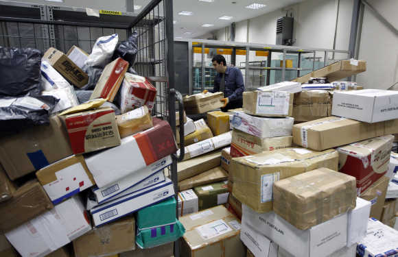 A worker sorts parcels in Turkish Post's postal logistic centre at the Ataturk International airport in Istanbul.