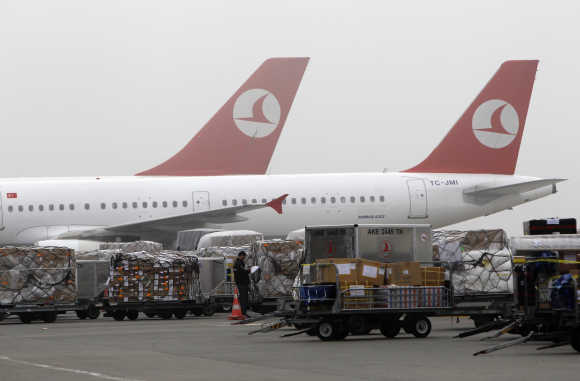 Cargo is offloaded from arriving aeroplanes outside of Turkish Post's postal logistic centre at the Ataturk International airport in Istanbul.