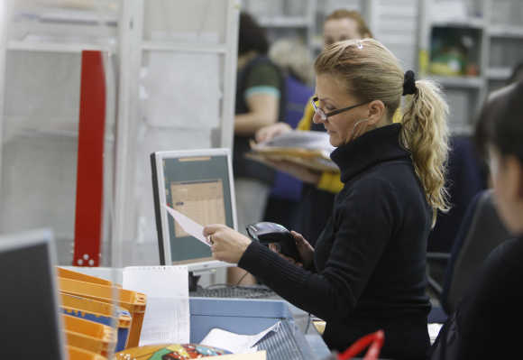 A worker in Bulgaria's main postal logistic centre in Sofia.