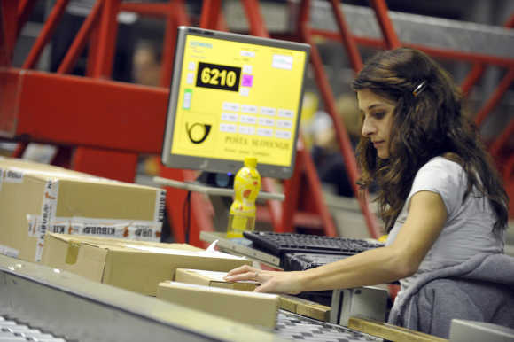 A worker checks mail in logistic centre in Ljubljana.