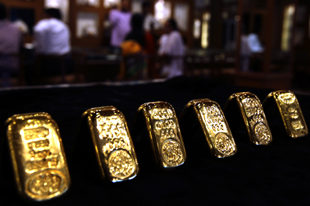 Gold biscuits are displayed inside a jewellery showroom in the southern Indian city of Hyderabad.