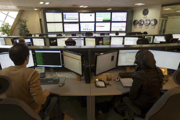Technicians monitor data flow in the control room of an Internet service provider in Tehran.