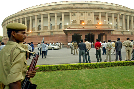 An Indian policeman keeps guard outside the premises of parliament house in New Delhi.