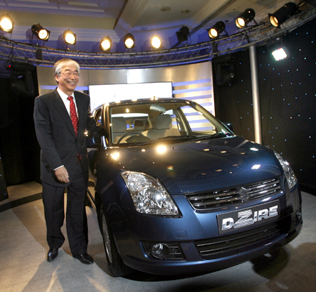 Managing Director of Maruti Suzuki, Shinzo Nakanishi, poses with 'DZire'.