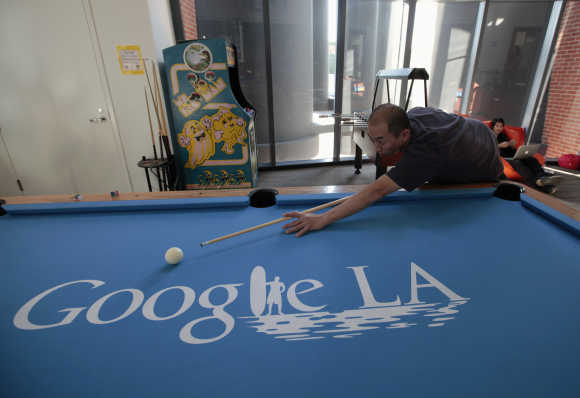 An employee plays pool at the Google campus near Venice Beach in Los Angeles.