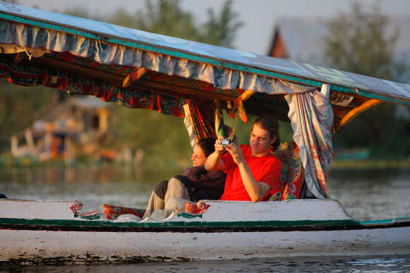 Tourists cruise along Dal Lake taking photos in Srinagar, Kashmir. Photo is for representation purpose only.