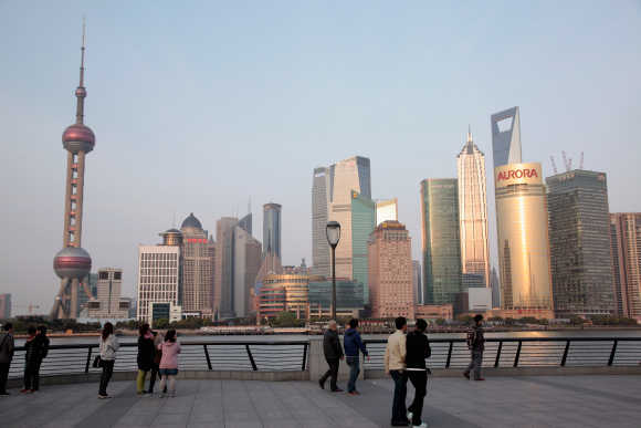 People walk in the Bund area of Shanghai.