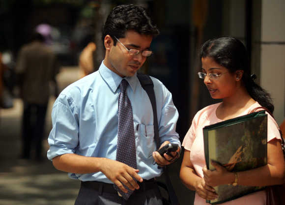 A student checks his mobile phone in Kolkata.