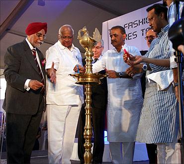 Union Agriculture Minister Sharad Pawar with Heavy Industries Minister Praful Patel and Deputy Chief Minister Ajit Pawar at the inauguration of the Vespa plant at Baramati.