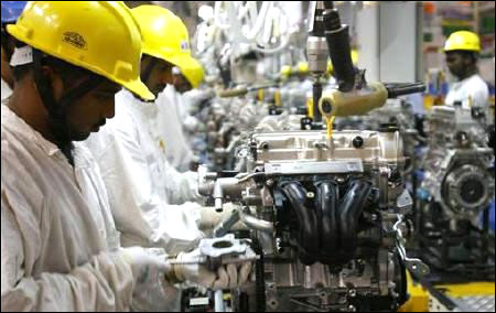 Employees work inside Maruti Suzuki petrol engine plant on the outskirts of New Delhi.