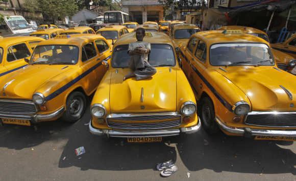 Some companies deduct salaries of taxi drivers for reaching destination late.