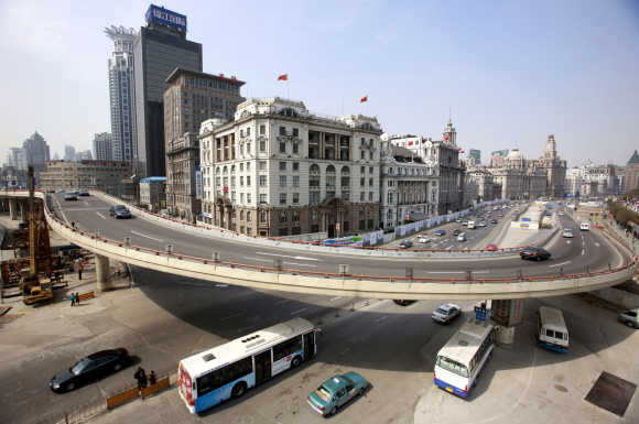 Traffic flows on a flyover at the Bund in Shanghai.