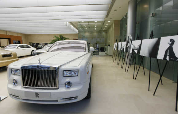 A cornish white Rolls-Royce Phantom car is on display at a Rolls-Royce showroom in Dubai.