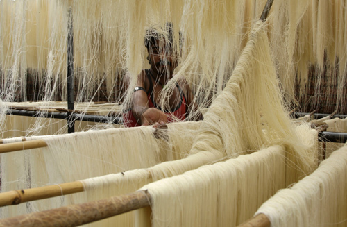 A worker dries vermicelli, a specialty eaten during the Muslim holy month of Ramadan.