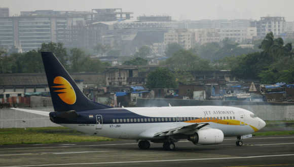 A Jet Airways aircraft waits for take off on the tarmac at the airport in Mumbai.