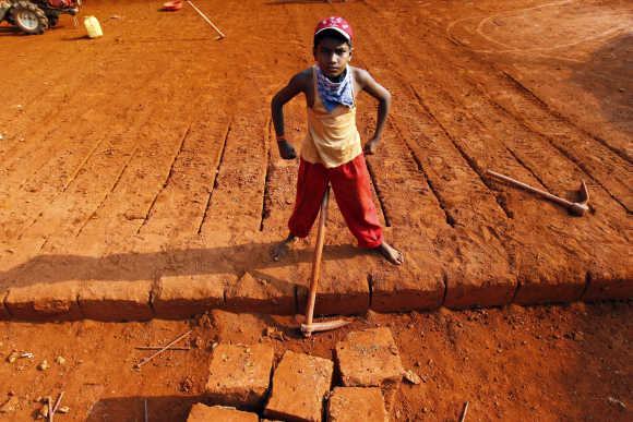 A boy poses at a laterite brick mine in Ratnagiri district, 360km south of Mumbai.