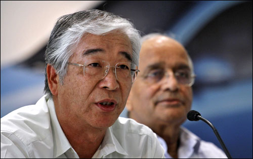 Maruti Suzuki India's MD and CEO Shinzo Nakanishi (L) speaks, beside Chairman R C Bhargava during a news conference in New Delhi on July 21, 2012.
